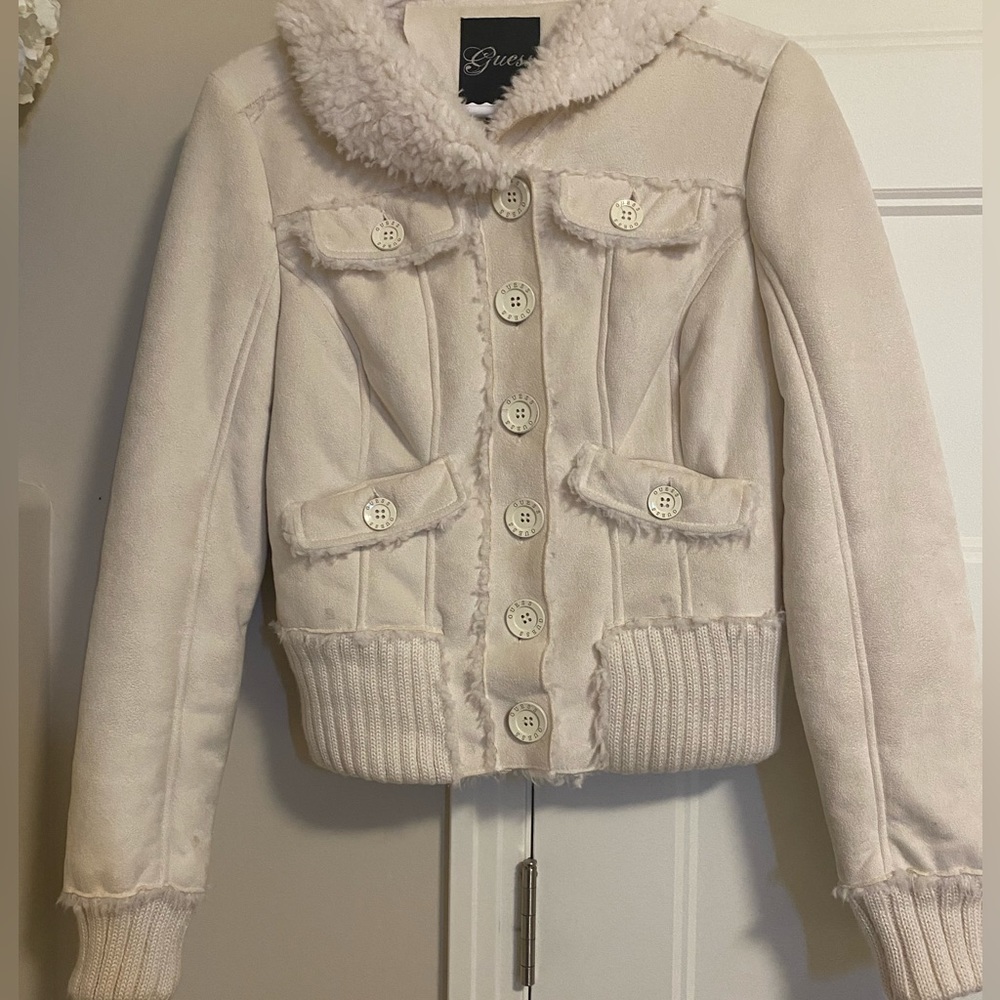 GUESS faux-leather coat features a faux-shearling lining and trim.